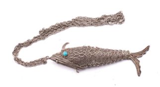 An Indian silver articulated fish, stamp