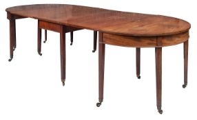 A George III mahogany extending dining t