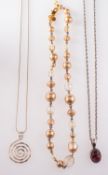 Three dress necklaces, to include a silv