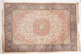 A Kashmir 'silky' rug, the ivory cartouc