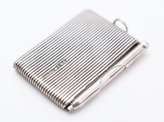A novelty silver notepad and pen, probab
