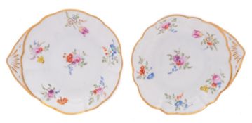 A pair of Swansea lobed shell-shaped dishes each painted with six floral sprays within a gilt line