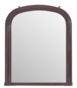 A Victorian mahogany framed overmantel mirror, circa 1878; of shallow arched form,