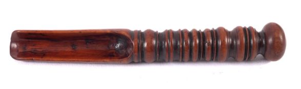 A 17th Century fruitwood apple corer, with ring turned handle and bun top, 14cm long.