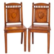 A pair of Victorian oak hall chairs,