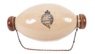 The Queens stoneware Muff warmer 'Regd 537485 Gourmet' of ovoid form with chain attachment,