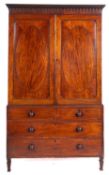A George IV mahogany linen press,