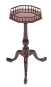 A George II mahogany kettle stand, with an octagonal baluster gallery top,