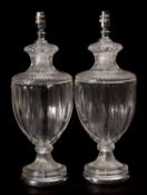 A pair of moulded clear glass table lamps,