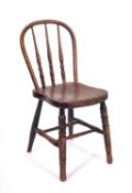 A child's 19th Century elm, ash and beechwood stick back Windsor chair,