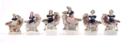 A group of six Staffordshire figure groups, of children riding goats, on oval bases,