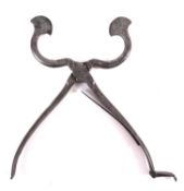 An 18th Century steel sugar cutter, with scimitar-shaped blades.