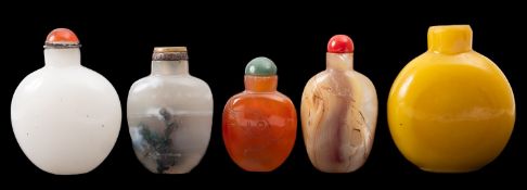 A group of five Chinese snuff bottles comprising a moss agate bottle and stopper,