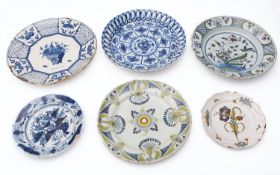 Six delft and faience plates. decorated variously, the largest 34cm diameter. [damages].