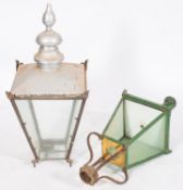 Two painted metal and glazed lanterns,