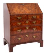 A George II walnut and feather banded bureau,