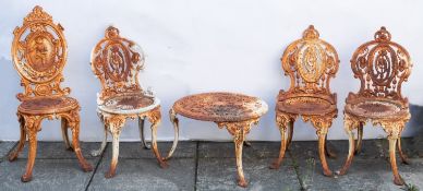 A set of three Edwardian painted cast iron garden chairs,