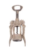An Italian double lever corkscrew, with vine pattern decoration, the centre in the form of a well.