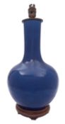 A Chinese blue monochrome bottle vase, Qing Dynasty [adapted as a lamp].