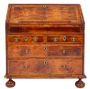 A George II featherbanded walnut bureau,