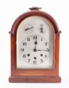 A German Edwardian mahogany bracket clock having an unsigned eight-day duration movement chiming