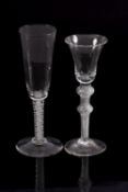 Two Dutch wine glasses comprising a bell shaped example on a double knobbed air twist stem on a