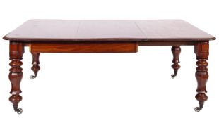 A Victorian mahogany extending dining table, with a telescopic action,