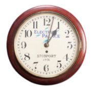 A mahogany wall clock having an eight-day duration,
