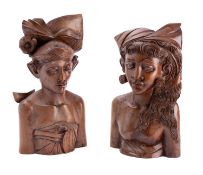 A pair of Indonesian carved hardwood male and female figures, 37cm high.