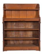 An oak and ebony inset open waterfall bookcase in Arts & Crafts style,