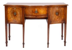 A late George III mahogany serpentine front sideboard,
