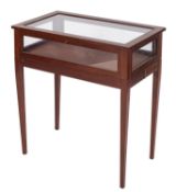 A mahogany and inlaid rectangular bijouterie display table, on a folding stand,
