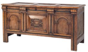 A late 17th/early 18th Century oak rectangular coffer, with a plain triple panel hinged top,
