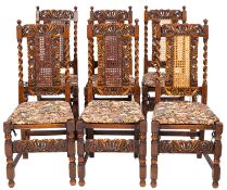 A set of eight oak and caneworked dining chairs,in William & Mary style,