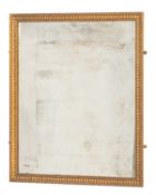A gilt composition framed rectangular wall mirror, in Empire taste,