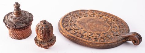 A carved treen, probably coquilla nut nutmeg grater,