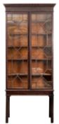 A George III mahogany and glazed bookcase on stand,