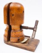 A Victorian beech and iron mounted milliner's hat stretcher,