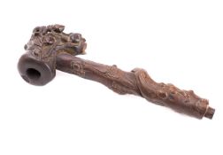 A Chinese rootwood pipe carved with a qilin and a lobster amongst peaches, flowers and foliage,