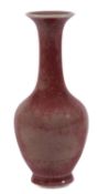 A Chinese peach bloom-glazed vase of pear shaped form with long slender neck and flared rim,