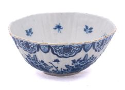 A Dutch blue and white delftware bowl of ribbed rounded octagonal form,