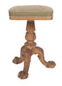 A Victorian later carved giltwood revolving piano stool, with a square upholstered stuff over seat,