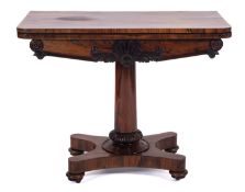 A Victorian rosewood rectangular card table, the baize lined hinged top with rounded corners,
