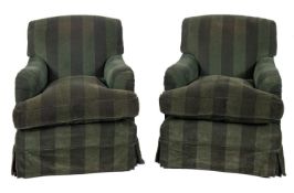 A pair of contemporary armchairs, fully upholstered in two tone green striped corduroy fabric.