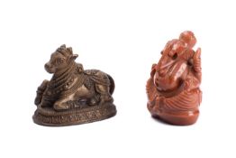 An Indian carved 'goldstone' model of Ganesh and an Indian bronze figure of a Nandi Bull,
