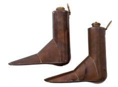 A pair of copper boot warmers, with brass screw tops and ring handles, 19cm x 19cm.