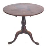 An 18th Century oak circular tea table,