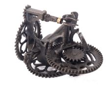 A bench mounted cast iron mechanical apple peeler, made in U.S.A by SInclair Scott Co., Baltimore.