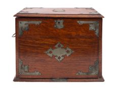 An Edwardian oak and metal mounted smoker's cabinet,