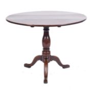 An 18th Century oak circular tea table,